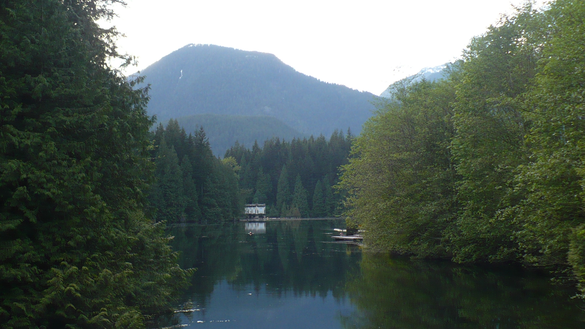 Buntzen Lake framed by forested mountains
